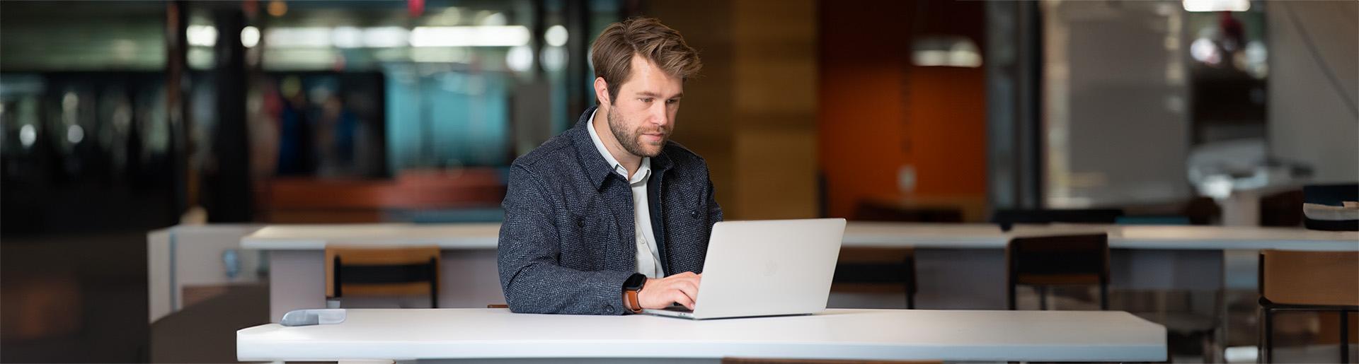 Graduates student at Cedarville University studies at his laptop.