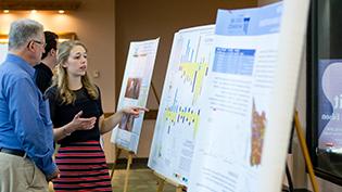 Student presents her research to a judge